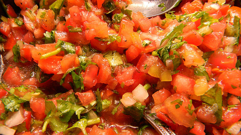 The Chilean inspiration in my romance books: Close up of pebre; you can see tomato, onion, and cilantro predominantly, all finely chopped. 