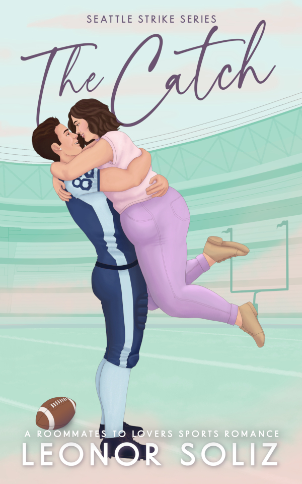 Cover. The hero, Saint, wears the navy blue team uniform, while the heroine, Ames, wears pants and a blouse in shades of lavender and blush. Saint holds Ames in his arms and off the ground, so it looks like he's catching her. They gaze at each other adoringly and smiling. The background looks like a stadium in shades of light minty green and soft peachy clouds.
